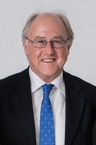 Headshot of Geoff Baird, General Manager - Communications and Marketing, smiling in a suit and tie.