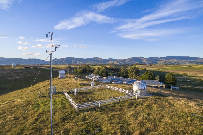 Side aerial shot of Lauder Atmospheric Research Station on a bright sunny day